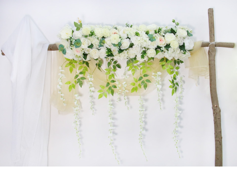 Adding stems and arranging the paper flowers into a bouquet